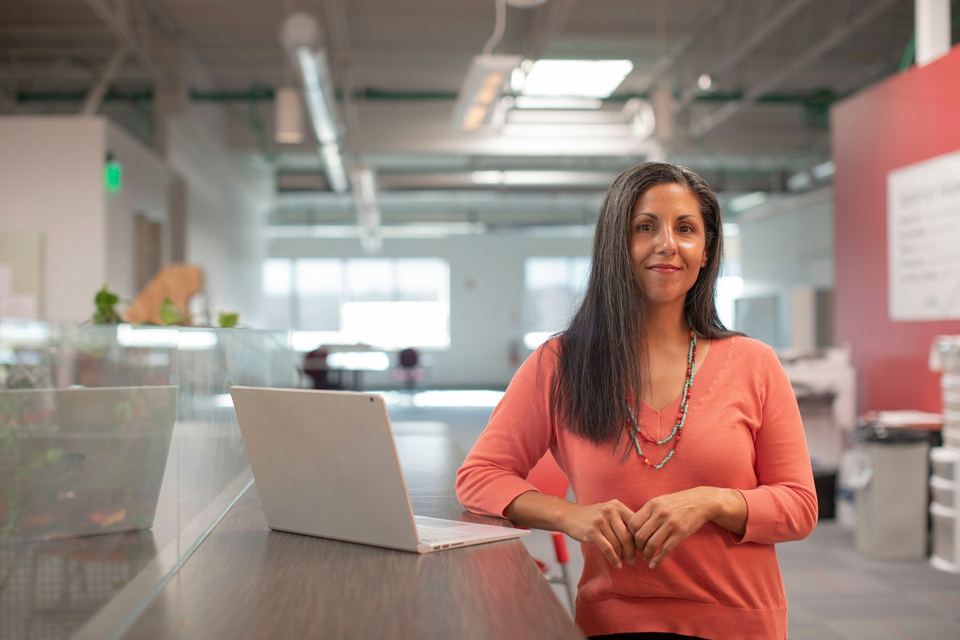 A finance leader reviewing the numbers at her desk